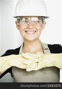 Portrait of a young woman smiling in protective eyewear