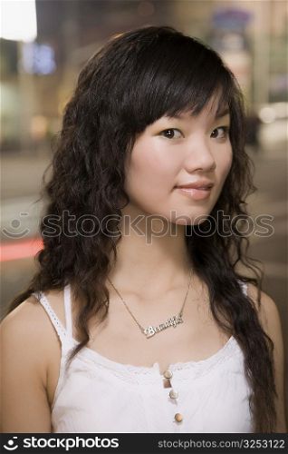 Portrait of a young woman smirking