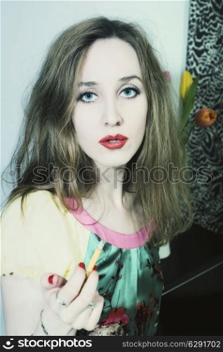 portrait of a young woman smoking cigarette closeup