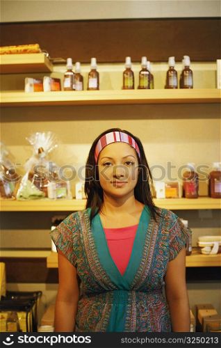 Portrait of a young woman standing in a store