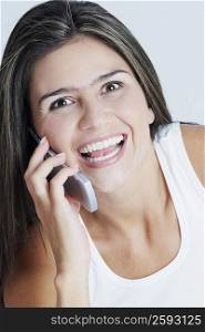 Portrait of a young woman talking on a mobile phone