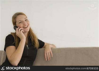 Portrait of a young woman talking on a mobile phone