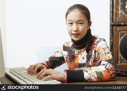 Portrait of a young woman using a computer