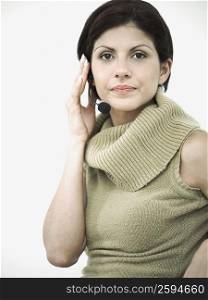 Portrait of a young woman using a headset