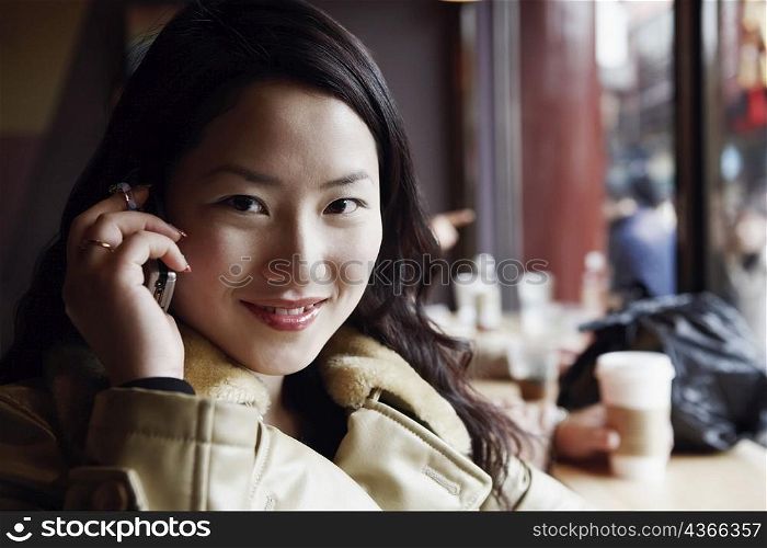 Portrait of a young woman using a mobile phone