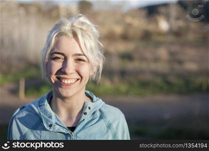 Portrait of a young woman walks outdoor as workout