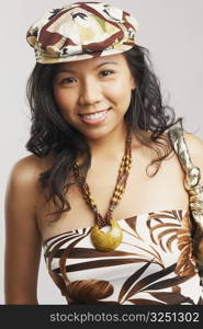 Portrait of a young woman wearing a cap and smiling