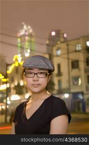 Portrait of a young woman wearing a flat cap