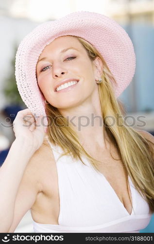 Portrait of a young woman wearing a hat