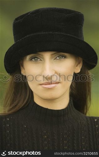Portrait of a young woman wearing a hat