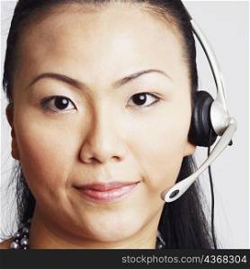 Portrait of a young woman wearing a headset