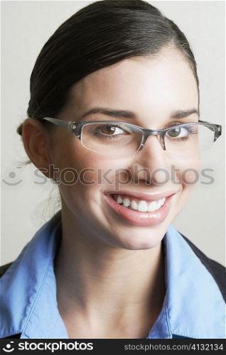 Portrait of a young woman wearing a pair of eyeglasses