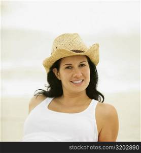 Portrait of a young woman wearing a sun hat