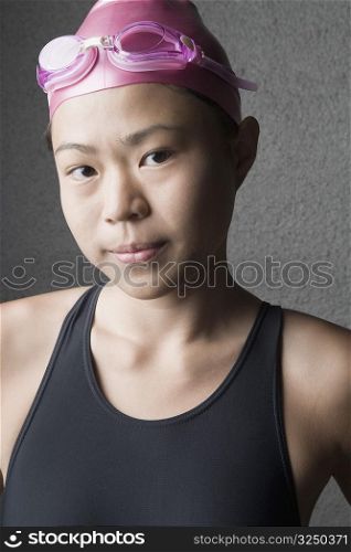 Portrait of a young woman wearing a swimming cap
