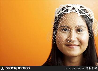 Portrait of a young woman wearing a veil
