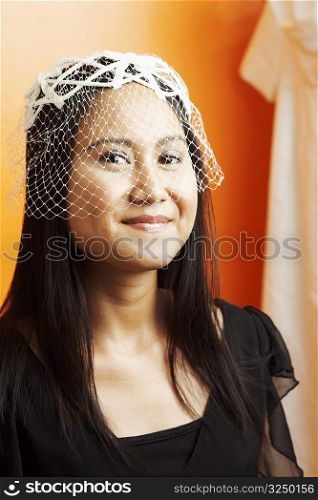Portrait of a young woman wearing a veil