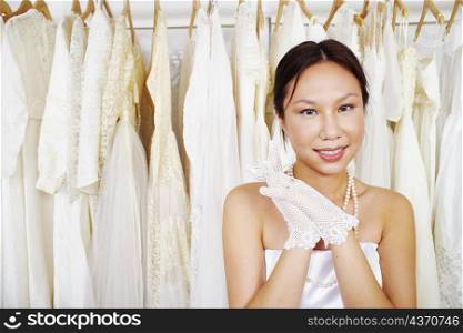 Portrait of a young woman wearing a wedding dress and smiling