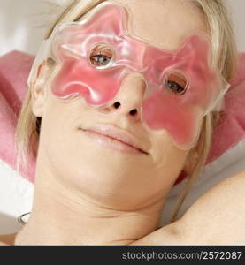 Portrait of a young woman wearing an eye mask