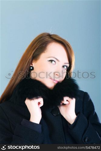 Portrait of a young woman wearing coat