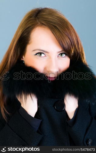 Portrait of a young woman wearing coat