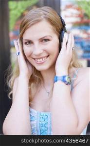 Portrait of a young woman wearing headphones