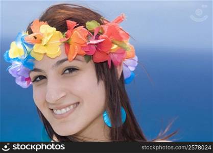 Portrait of a young woman wearing lei and smiling, Diamond Head, Waikiki Beach, Honolulu, Oahu, Hawaii Islands, USA