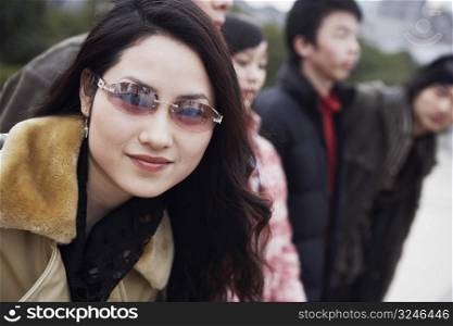 Portrait of a young woman wearing sunglasses
