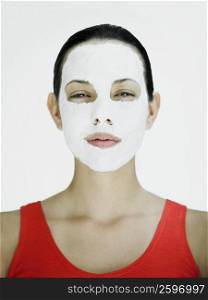 Portrait of a young woman with a facial mask
