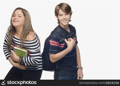 Portrait of a young woman with a teenage boy smiling