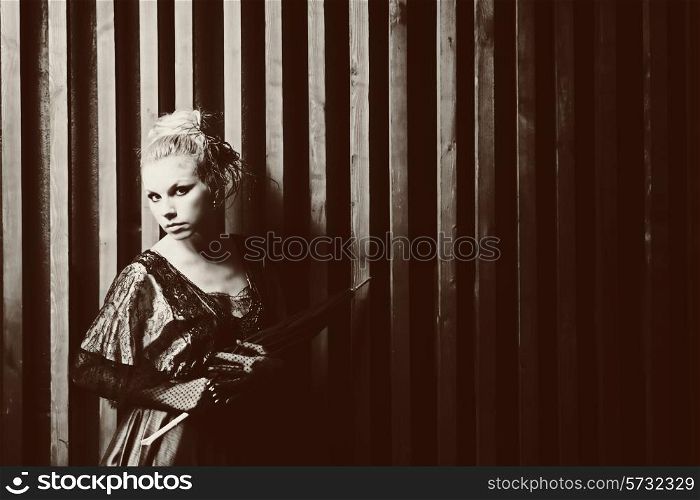 Portrait of a young woman with an umbrella. retro Style