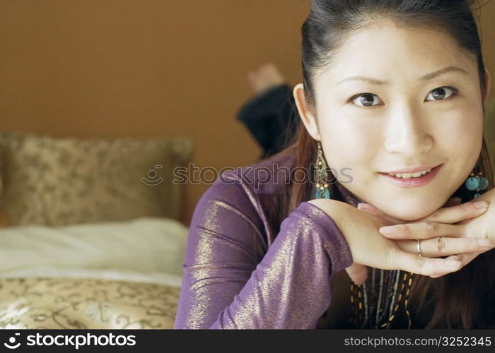 Portrait of a young woman with her hand on her chin