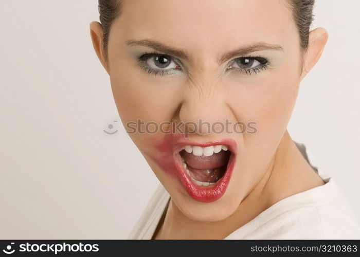 Portrait of a young woman with her messy lips