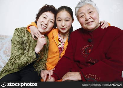 Portrait of a young woman with her mother and her grandmother