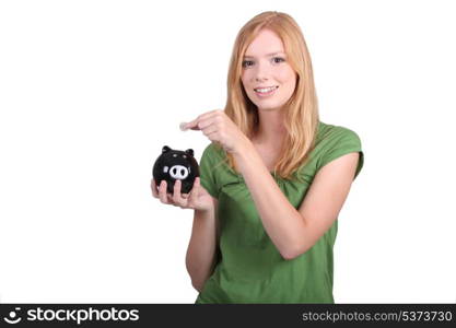 portrait of a young woman with money box