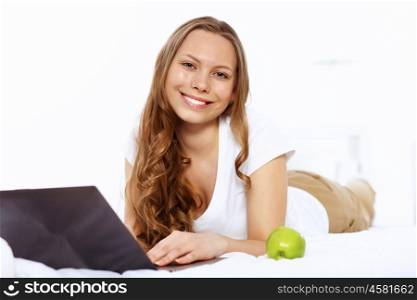 Portrait of a young woman with notebook