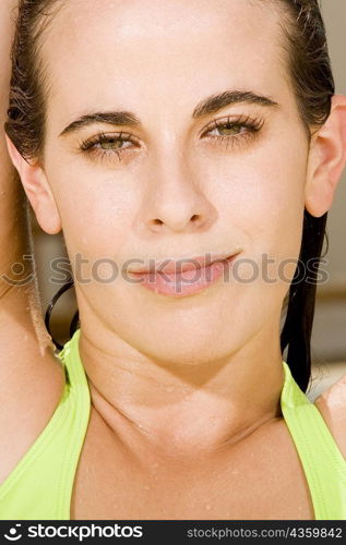 Portrait of a young woman with wet hair