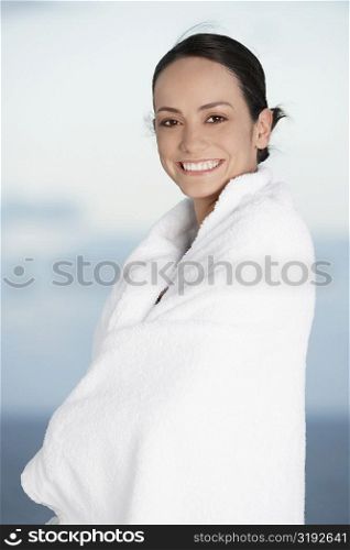 Portrait of a young woman wrapped in a towel