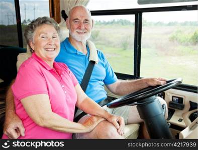 Portrait of active senior couple in their motor home.