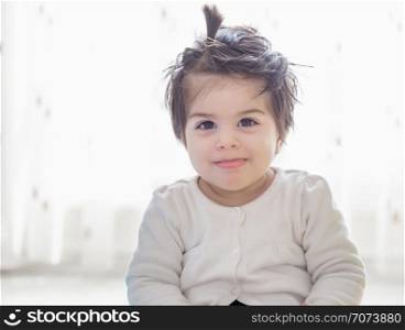 Portrait of adorable cute little baby girl toddler looking at camera . Portrait of adorable cute little baby girl