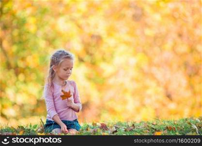 Portrait of adorable little girl outdoors at beautiful autumn day. Adorable little girl at beautiful autumn day outdoors
