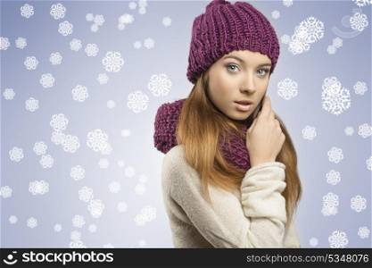 portrait of adorable young woman with long smooth hair posing and wearing winter clothes, purple wool hat and scarf, white sweater