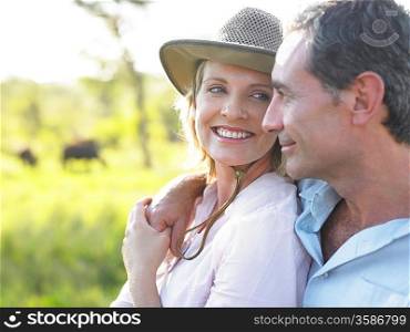 Portrait of adult couple woman looking at man smiling