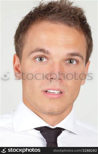 Portrait of afraid looking businessman isolated on white