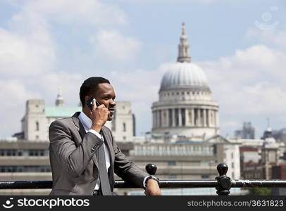 Portrait of African American businessman talking on Cell phone in London