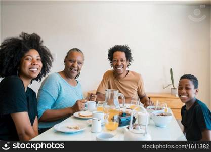Portrait of African american family having breakfast together at home. Family and lifestyle concept.. Family having breakfast together at home.
