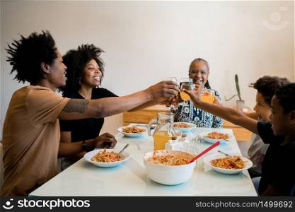 Portrait of African american family having lunch together at home. Family and lifestyle concept.