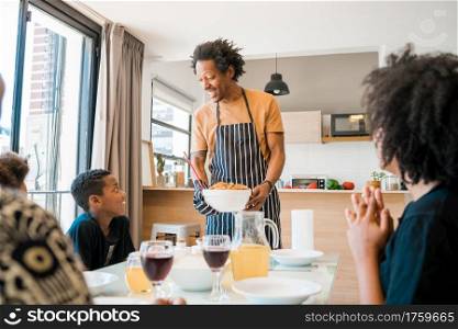 Portrait of African american family having lunch together at home. Family and lifestyle concept.