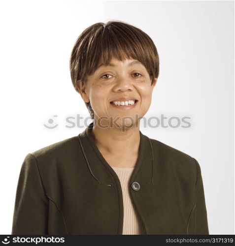 Portrait of African American middle-aged woman smiling and looking at viewer.