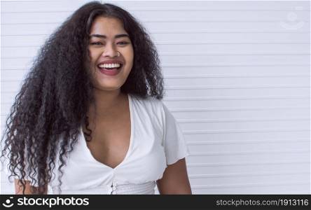 Portrait of african black woman posing and standing with confidence with white background and copy space