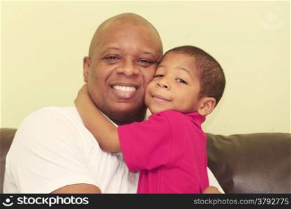 Portrait of african father and his son. Focus in the kid.